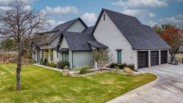 view of front of property with a front lawn and a garage