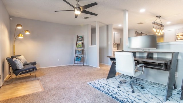 home office with light carpet and ceiling fan