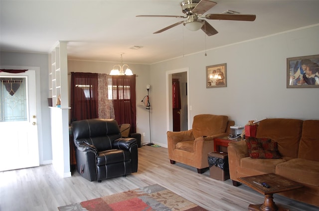 living room with crown molding, ceiling fan with notable chandelier, and light wood-type flooring