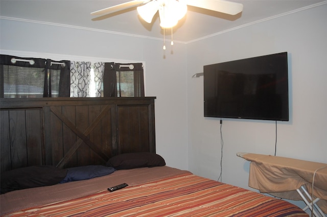 bedroom featuring ceiling fan and ornamental molding