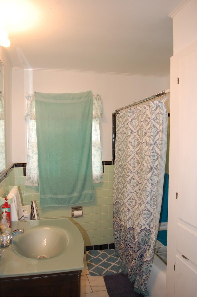 bathroom featuring tile walls, vanity, tile patterned flooring, and a shower with shower curtain