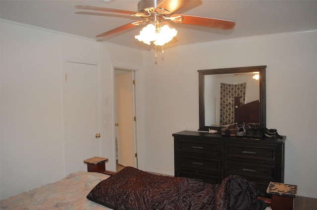 bedroom featuring crown molding and ceiling fan