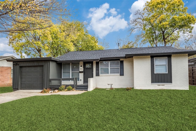 ranch-style home with a front yard and a garage