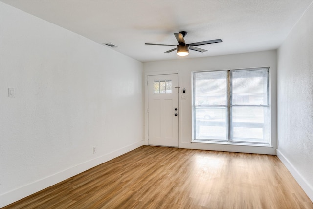 foyer featuring ceiling fan and light hardwood / wood-style floors