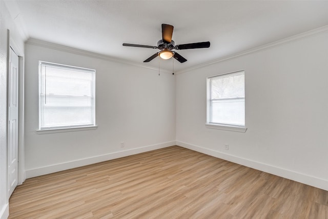 unfurnished room featuring ceiling fan, crown molding, and light hardwood / wood-style flooring