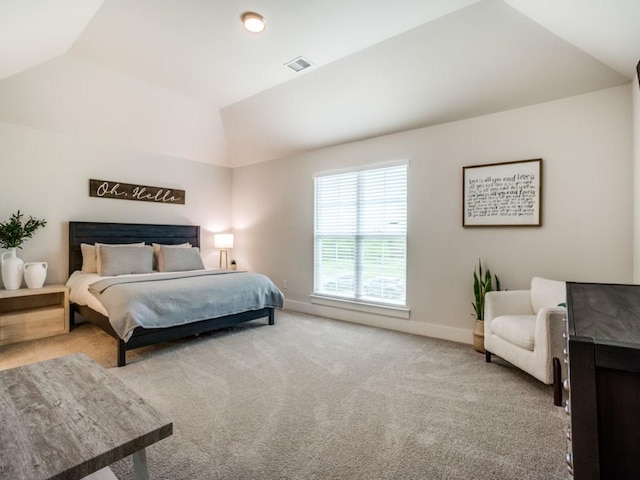 carpeted bedroom featuring vaulted ceiling