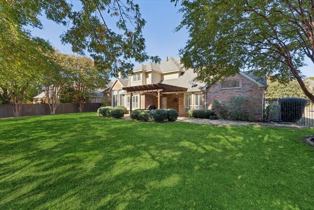 rear view of property featuring a lawn and a pergola