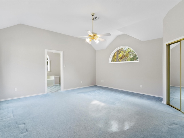 interior space featuring carpet and vaulted ceiling