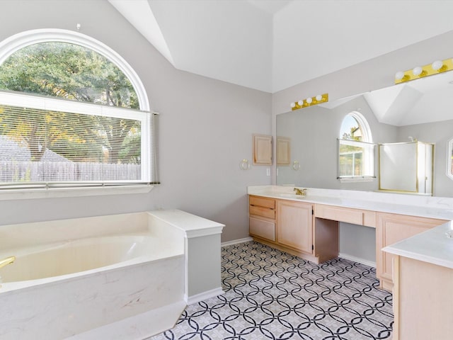 bathroom with plenty of natural light, plus walk in shower, lofted ceiling, and vanity