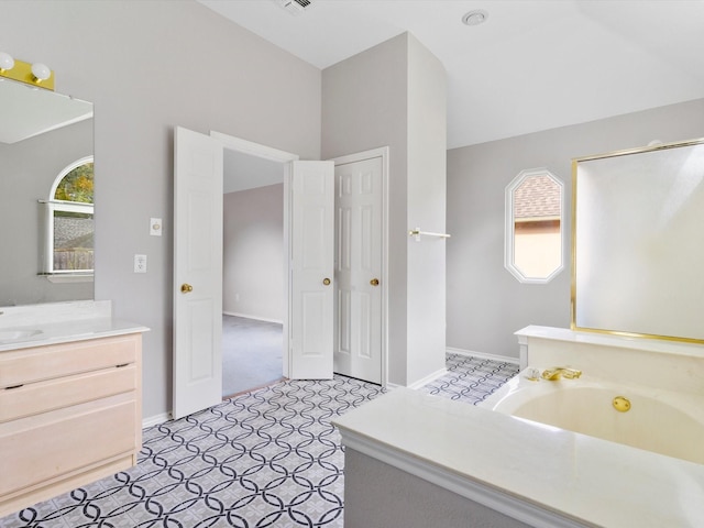 bathroom featuring vanity and a bathing tub