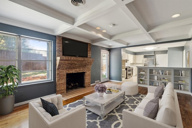 living room with hardwood / wood-style floors, a fireplace, beamed ceiling, and coffered ceiling