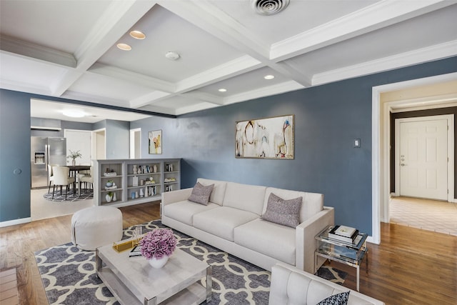 living room featuring hardwood / wood-style flooring, beam ceiling, ornamental molding, and coffered ceiling