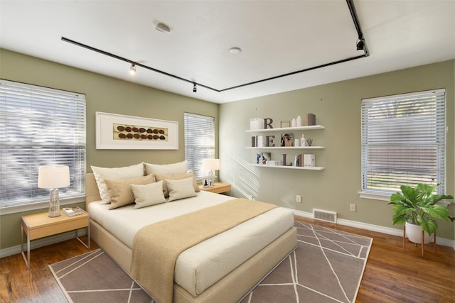 bedroom featuring dark wood-type flooring