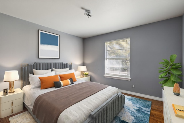 bedroom featuring dark hardwood / wood-style flooring