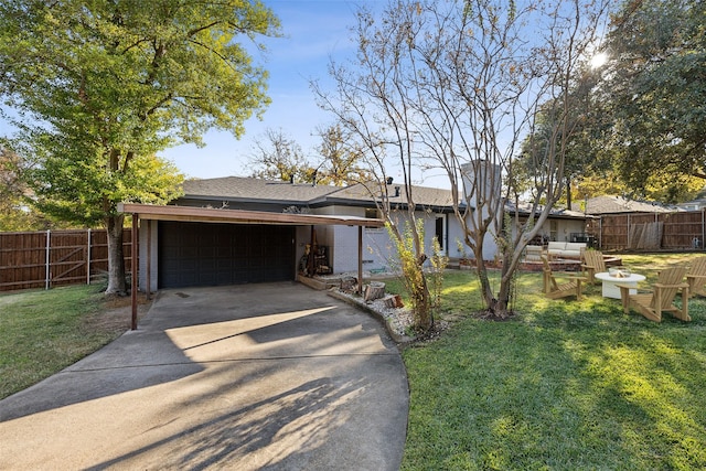 ranch-style home featuring a garage and a front lawn