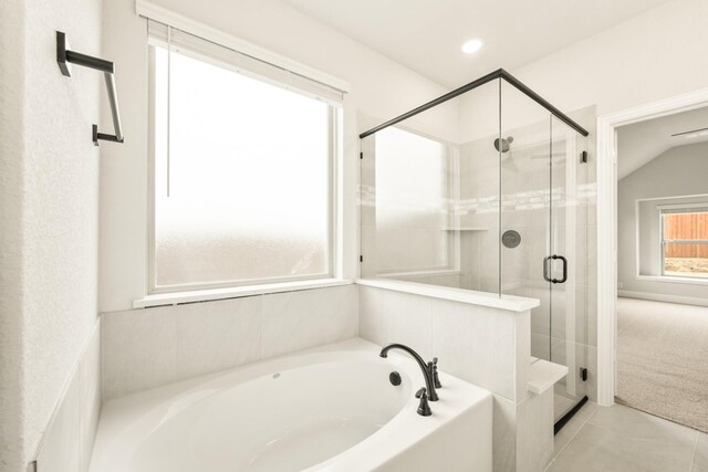 bedroom with ceiling fan, light carpet, and vaulted ceiling