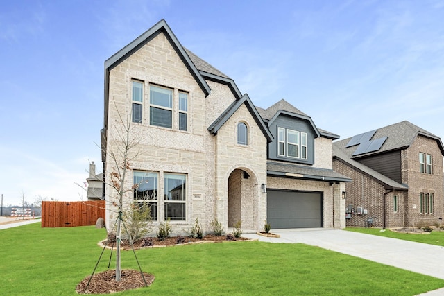 view of front of home with a garage and a front yard