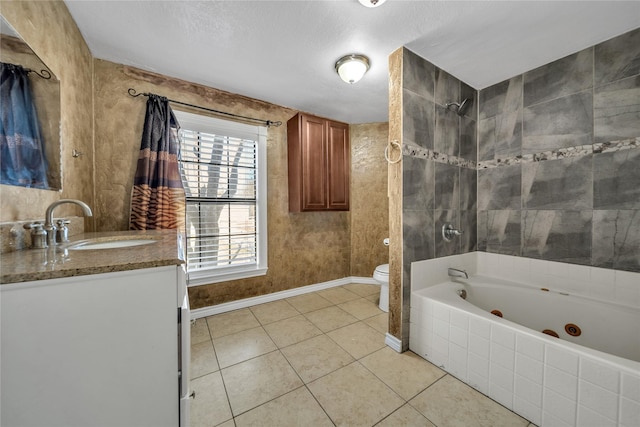 full bathroom with tile patterned floors, vanity, a textured ceiling, toilet, and tiled shower / bath