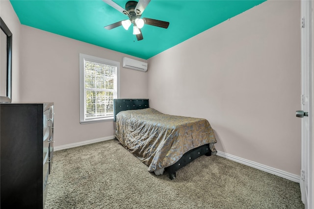 carpeted bedroom with ceiling fan and a wall mounted air conditioner