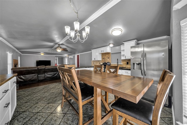 dining room featuring crown molding, ceiling fan with notable chandelier, and vaulted ceiling