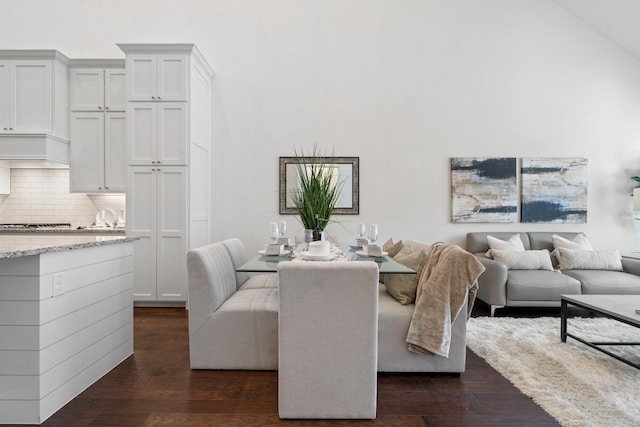 dining area with dark wood-type flooring