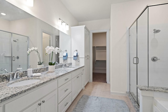 bathroom with vanity, tile patterned floors, and walk in shower