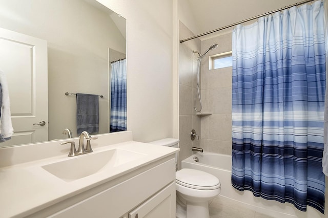 full bathroom featuring tile patterned flooring, shower / bath combination with curtain, vanity, and toilet