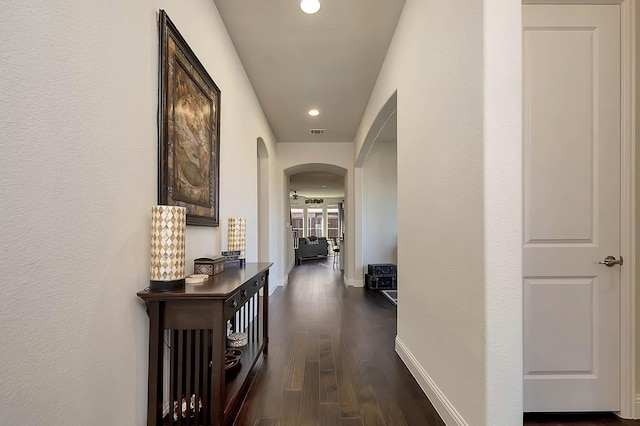 corridor with dark wood-type flooring