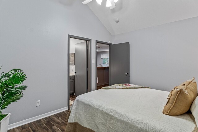 bedroom with ensuite bathroom, high vaulted ceiling, ceiling fan, and dark wood-type flooring