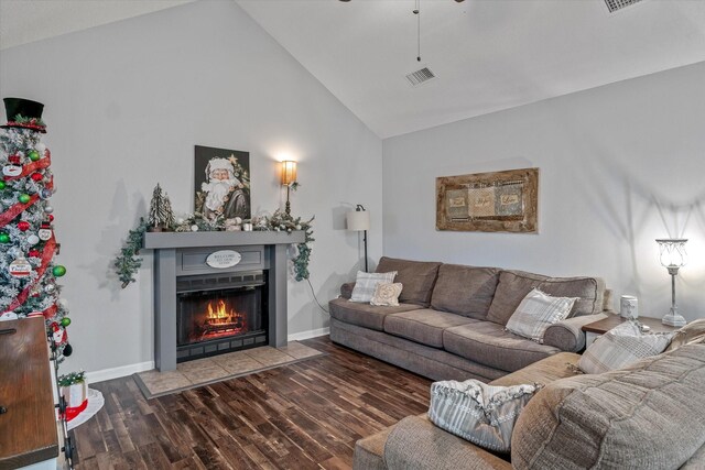 living room with high vaulted ceiling and dark wood-type flooring