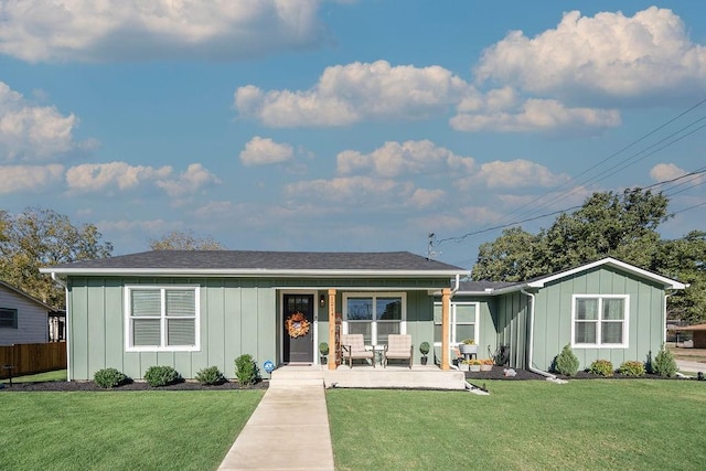 single story home featuring a porch and a front lawn