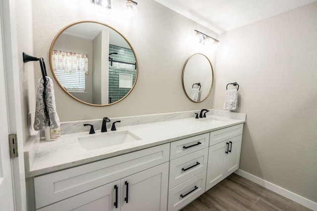 bathroom with hardwood / wood-style flooring and vanity