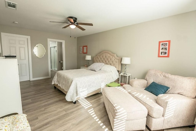 bedroom featuring light hardwood / wood-style flooring and ceiling fan