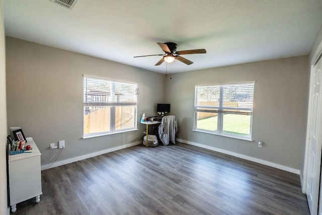 misc room featuring dark hardwood / wood-style floors, plenty of natural light, and ceiling fan