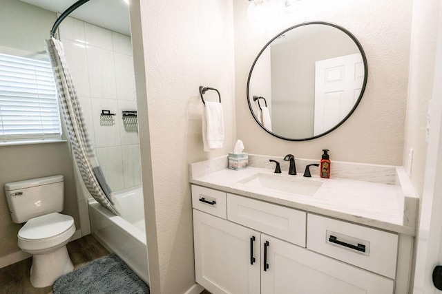 full bathroom with hardwood / wood-style flooring, vanity, toilet, and shower / tub combo with curtain