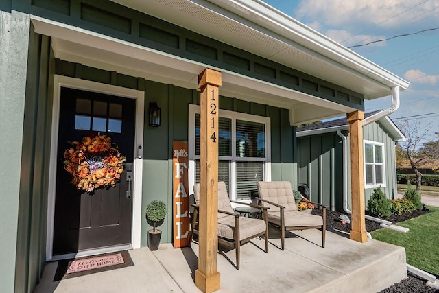 view of exterior entry with a porch