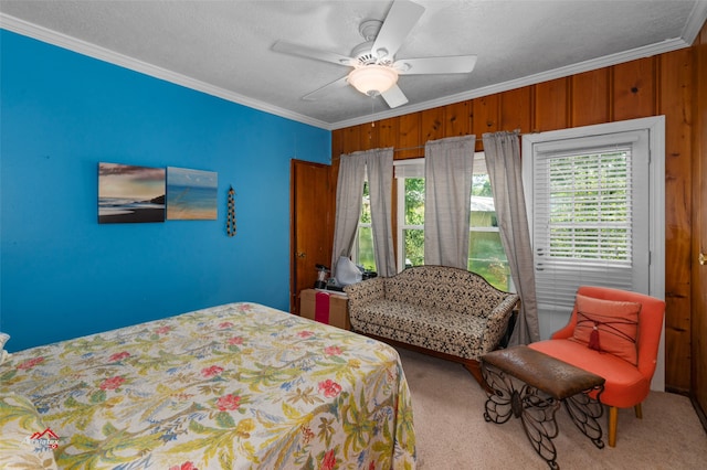 bedroom featuring crown molding, carpet, and ceiling fan