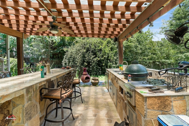 view of patio with a pergola and an outdoor wet bar