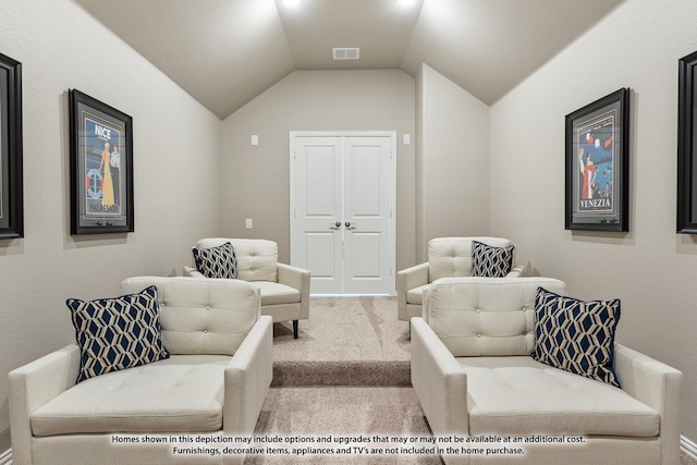 living area with carpet and vaulted ceiling