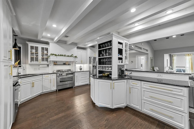 kitchen with dark wood-type flooring, sink, decorative backsplash, appliances with stainless steel finishes, and white cabinetry