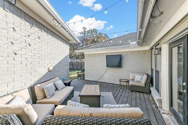 wooden terrace featuring outdoor lounge area