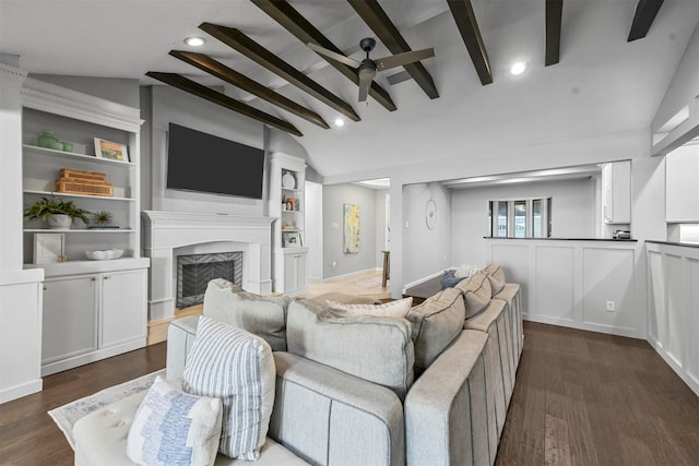 living room featuring lofted ceiling with beams, dark hardwood / wood-style floors, and ceiling fan