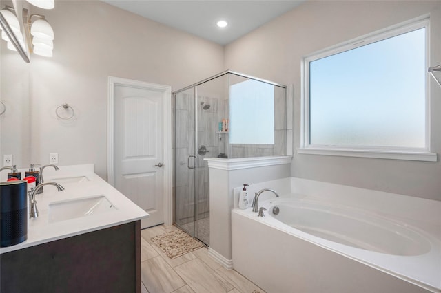 bathroom with separate shower and tub and vanity