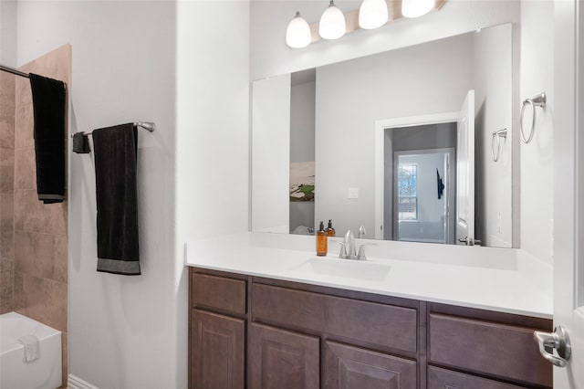 bathroom featuring bathtub / shower combination and vanity