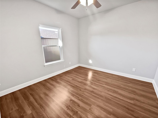 empty room featuring ceiling fan and hardwood / wood-style floors