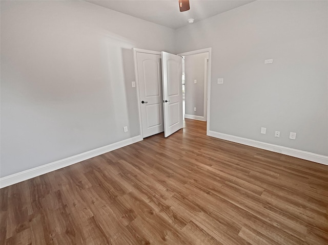 spare room featuring hardwood / wood-style flooring and ceiling fan