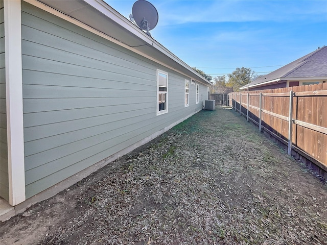 view of yard featuring central air condition unit