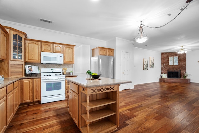 kitchen with open shelves, white appliances, dark wood-style flooring, and a fireplace