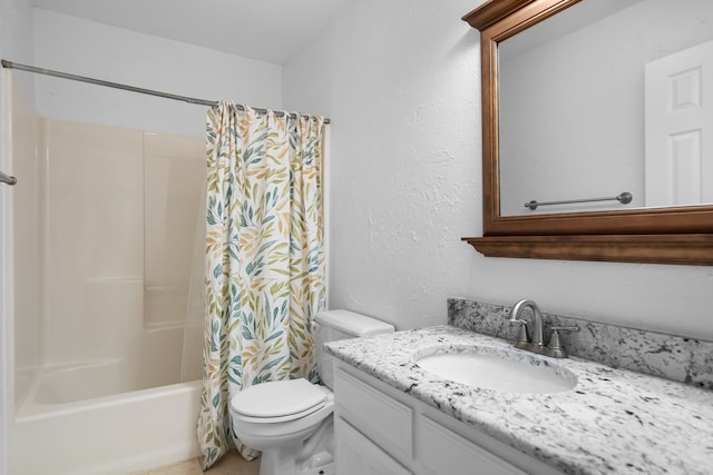 bathroom with shower / tub combo, a textured wall, vanity, and toilet