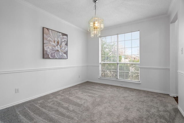 unfurnished room with ornamental molding, carpet floors, and a textured ceiling